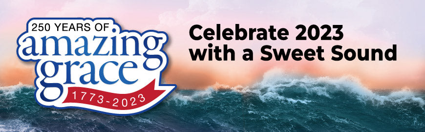 Agitated sea and picturesque beach with the Amazing Grace logo and a caption to celebrate 2023.